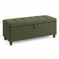 Panca contenitore in tessuto verde con gambe in legno